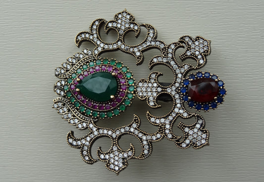 A fine antique silver brooch with gemstones and zircon