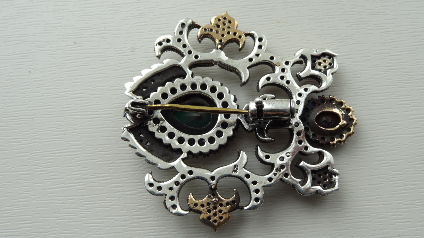 A fine antique silver brooch with gemstones and zircon