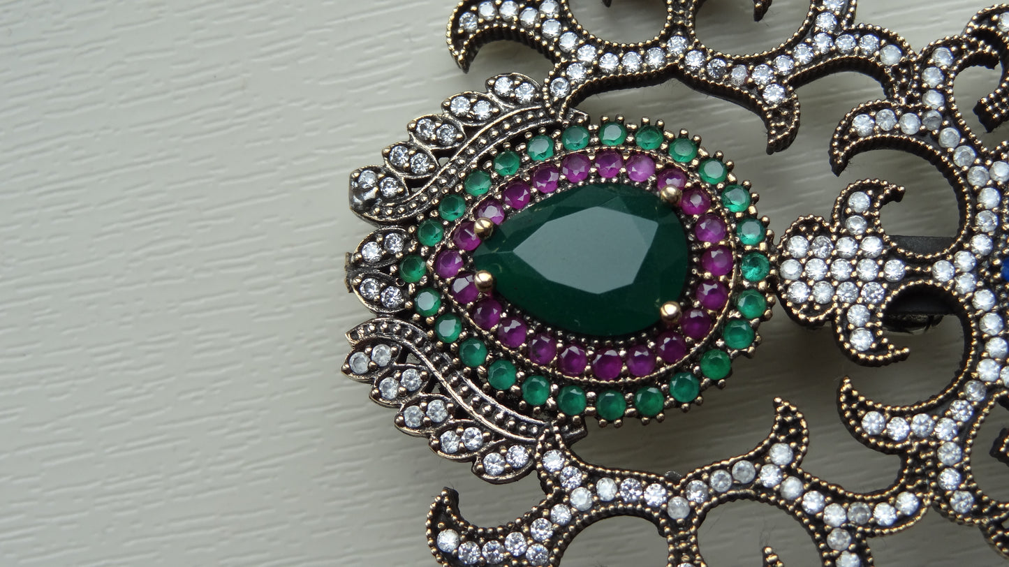 A fine antique silver brooch with gemstones and zircon