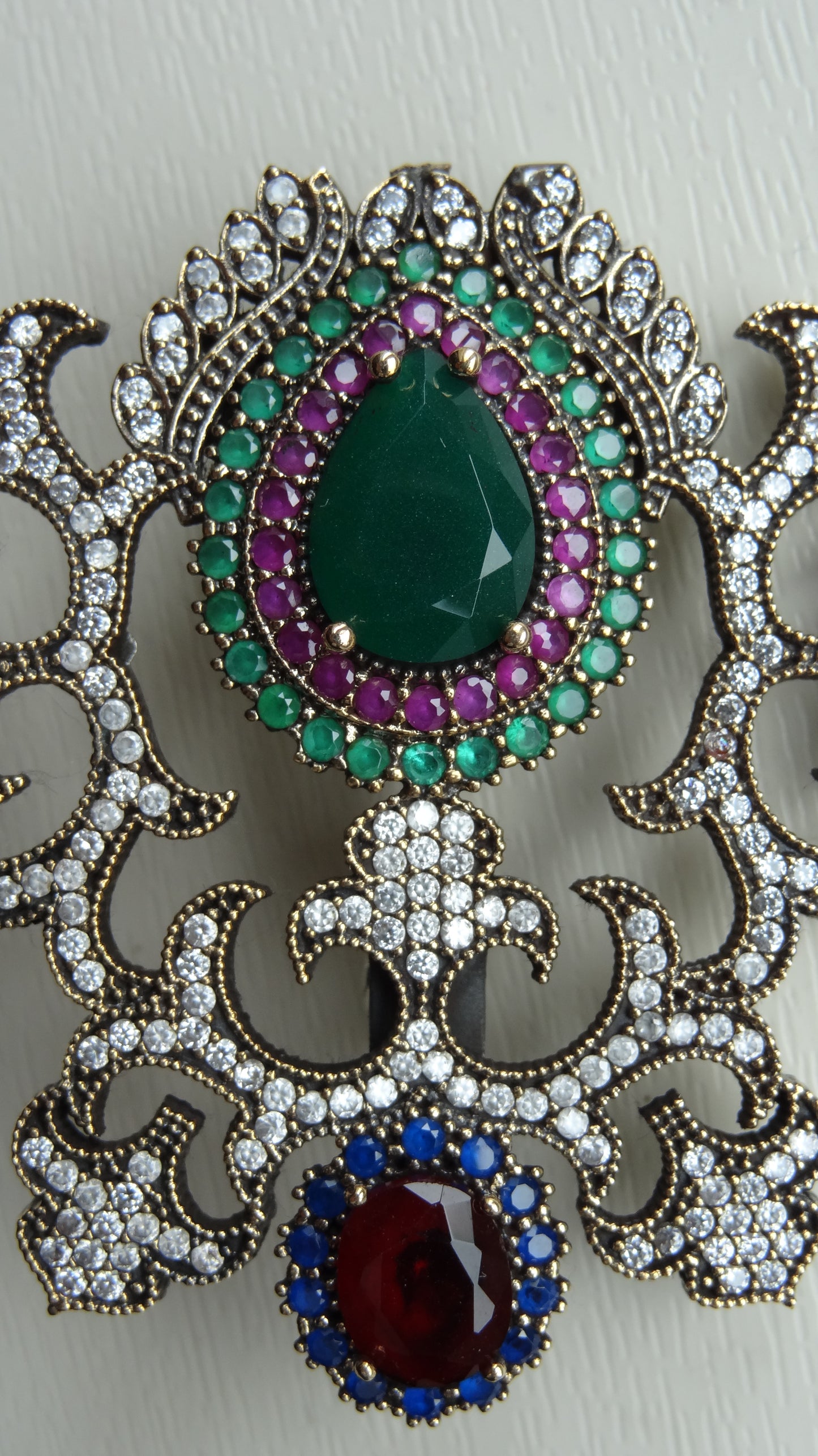 A fine antique silver brooch with gemstones and zircon