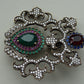 A fine antique silver brooch with gemstones and zircon