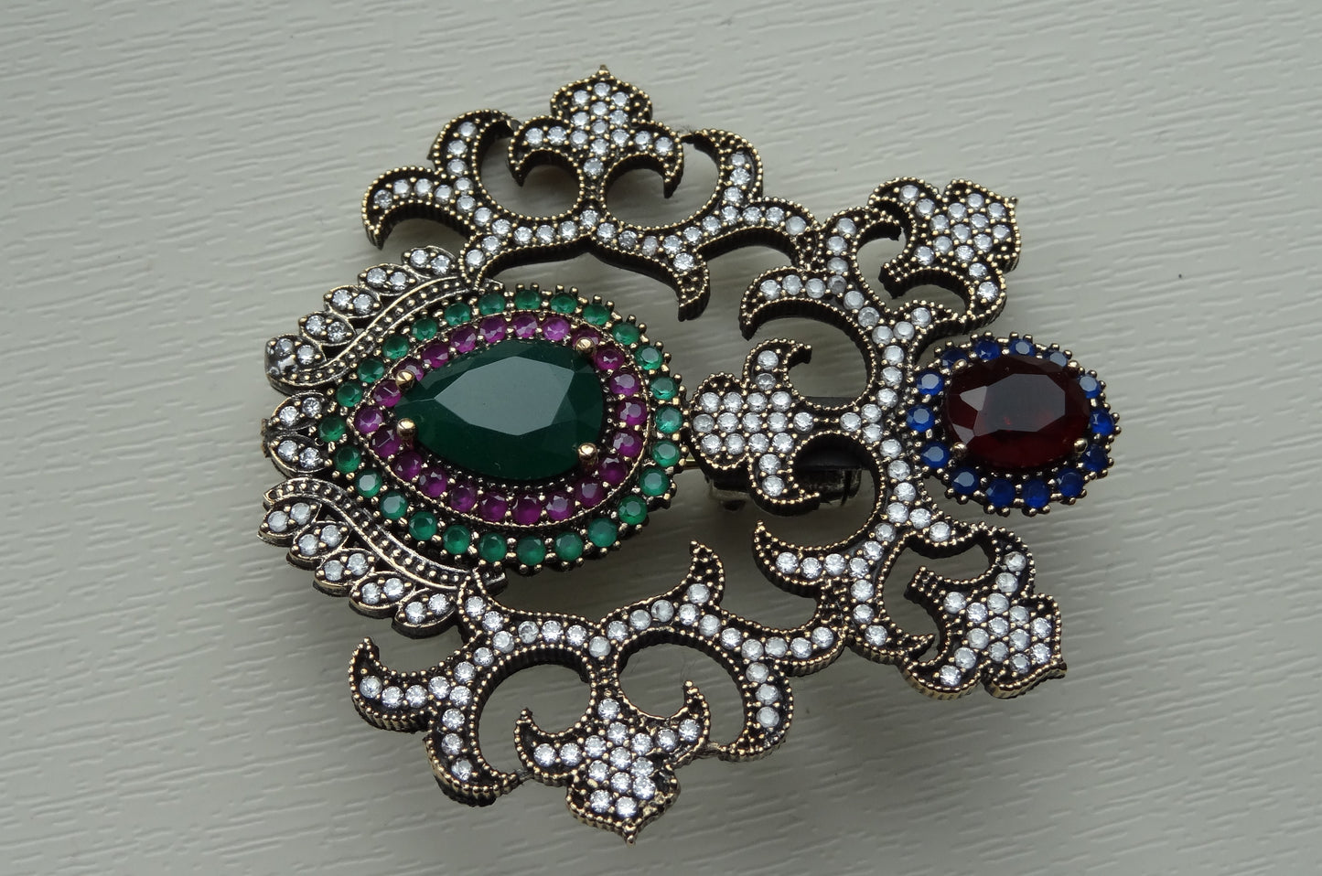 A fine antique silver brooch with gemstones and zircon