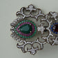 A fine antique silver brooch with gemstones and zircon