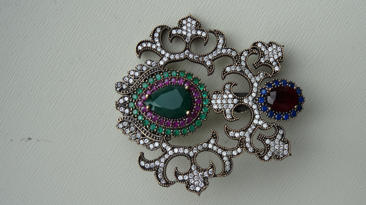 A fine antique silver brooch with gemstones and zircon